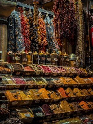 Colorful display of diverse spices and dried goods at a bustling İstanbul market.