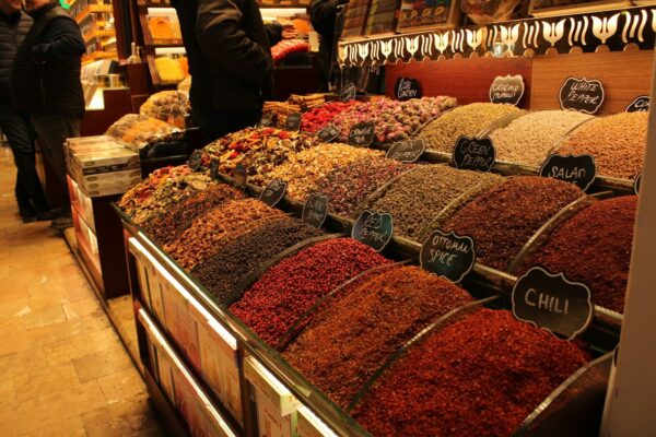 Spices are displayed at a market.