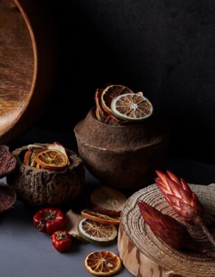 brown and red round fruit on brown wooden round table
