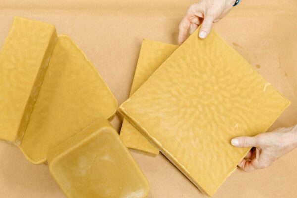 A person is holding a piece of yellow paper