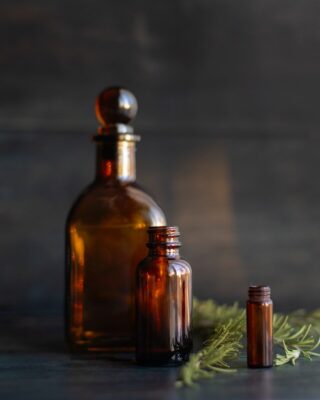 Doğanın Kadim Mirası: Sedir Yağı ve Kullanım Alanları Hakkında Kapsamlı Rehber A couple of bottles sitting on top of a table