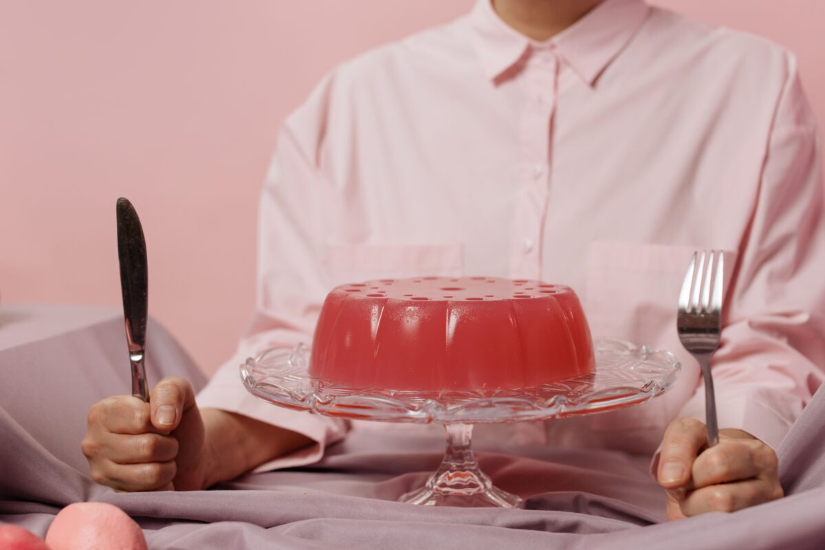 Elegant table setting with red gelatin dessert, evoking a sweet and inviting atmosphere.