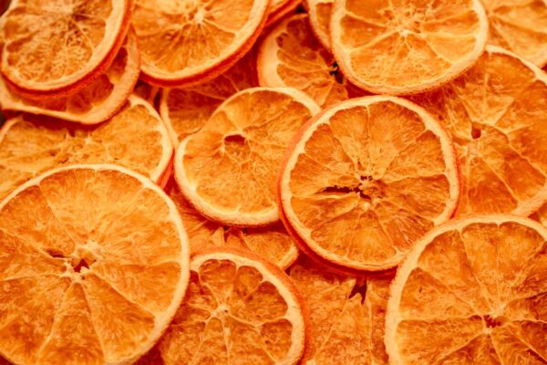 Close-up of dried orange slices, perfect for healthy lifestyle themes and natural decor.
